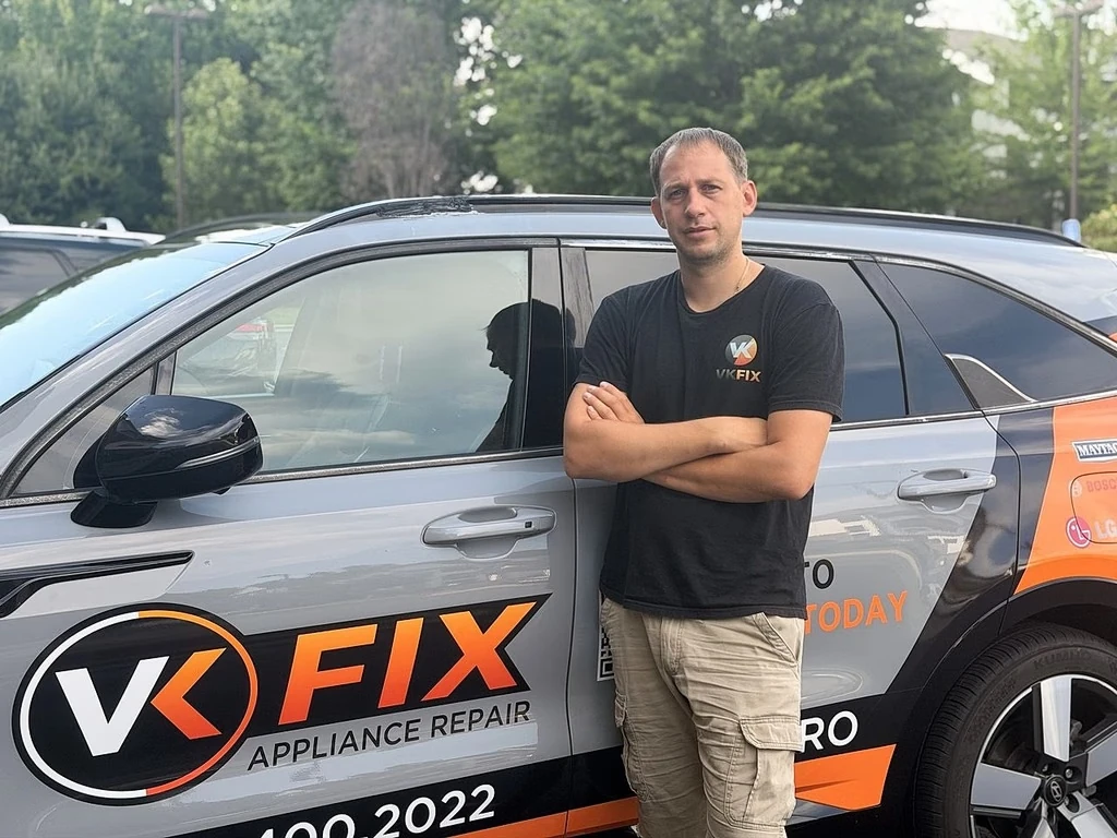 VKFIX technician and branded service vehicle