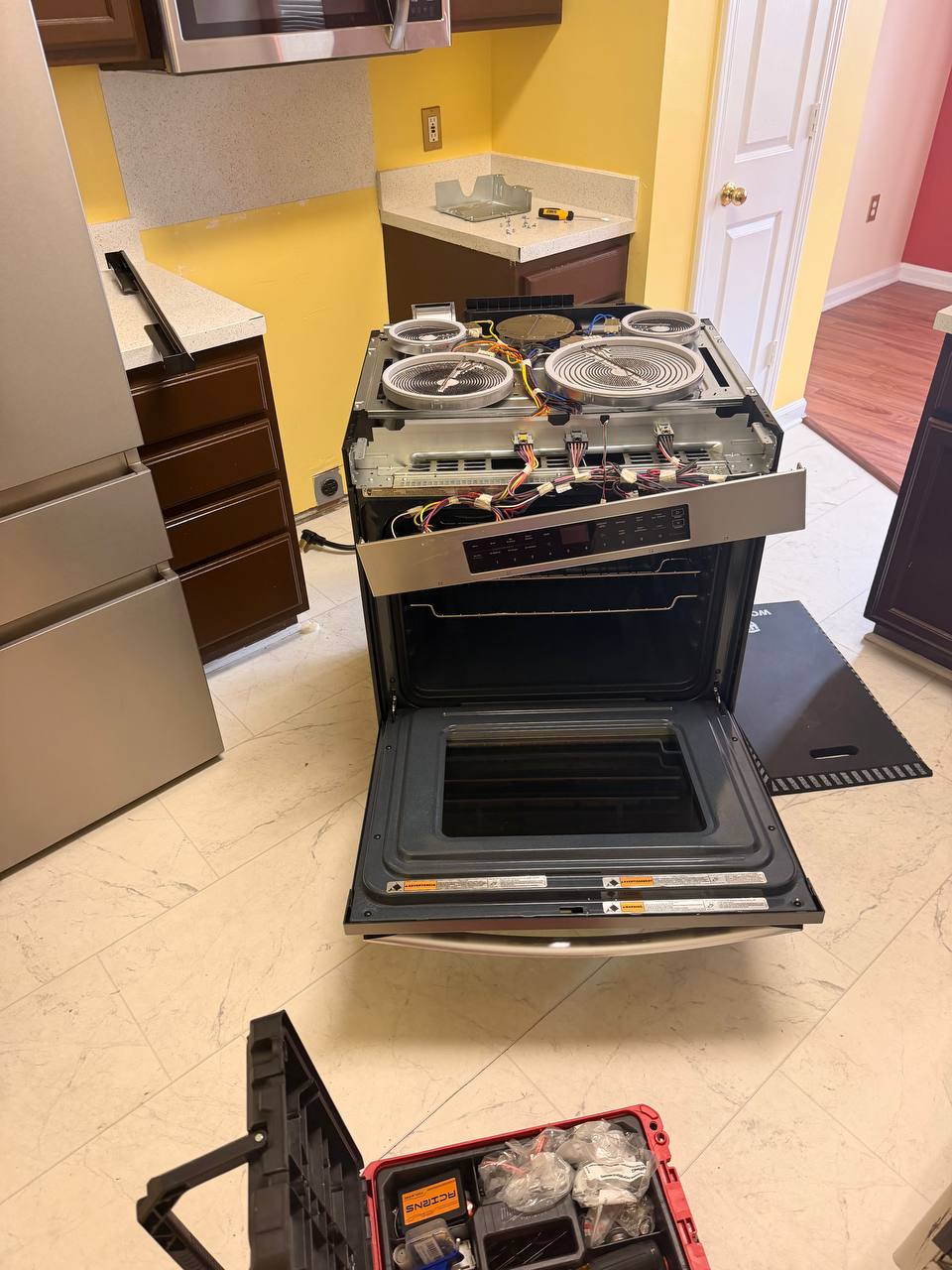 Gas range and tools during an appliance service visit